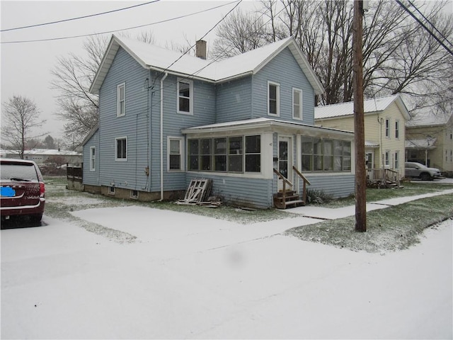 view of front of property with a sunroom