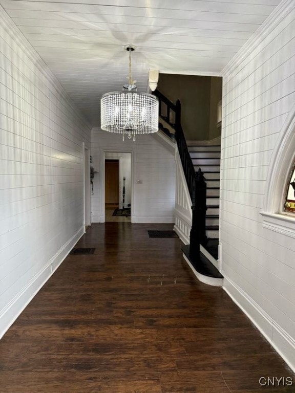 interior space featuring dark hardwood / wood-style floors and an inviting chandelier