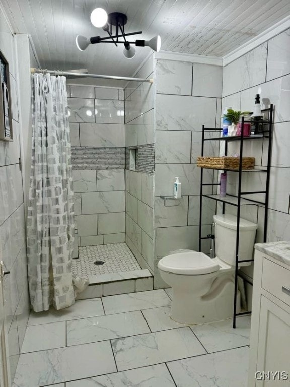 bathroom with a shower with shower curtain, toilet, vanity, tile walls, and ornamental molding