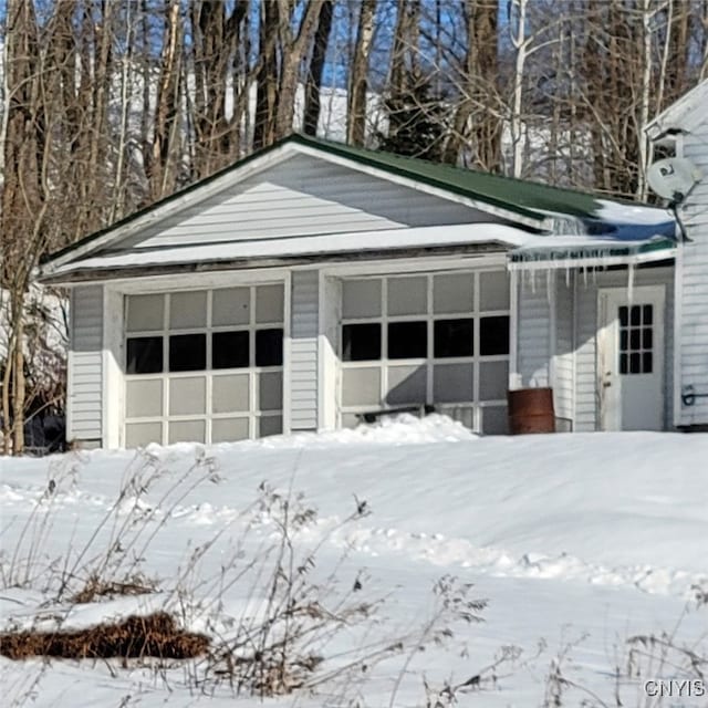 view of snow covered garage