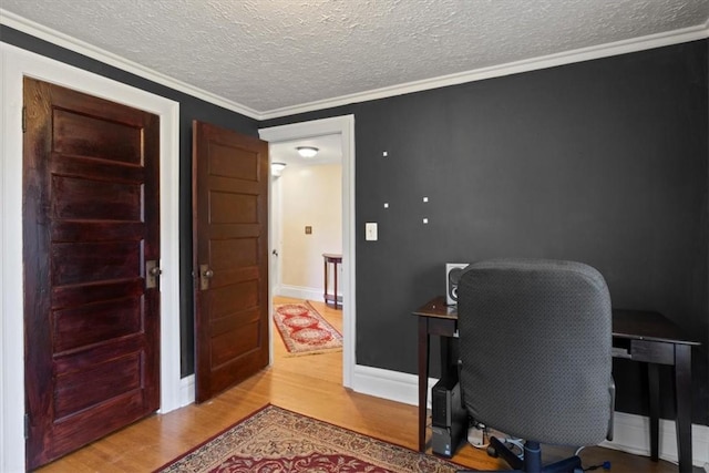 office space with crown molding, wood-type flooring, and a textured ceiling