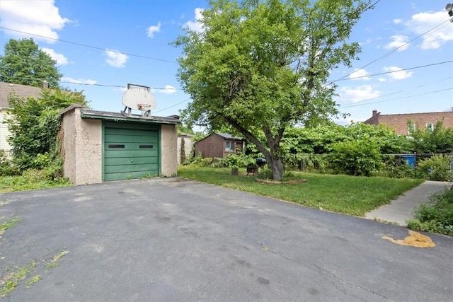 garage with a yard