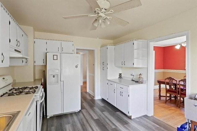 kitchen featuring white cabinets, ceiling fan, white appliances, and dark wood-type flooring