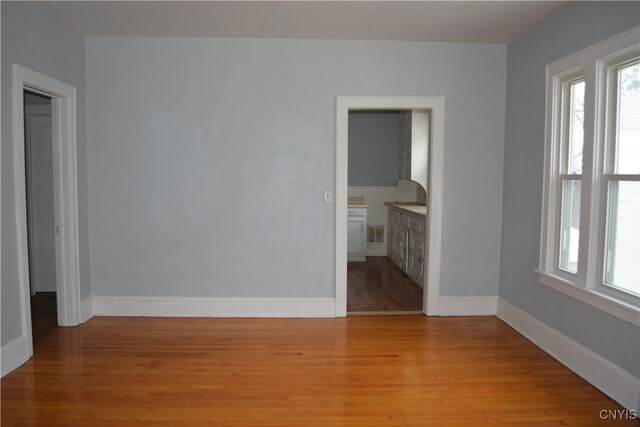 spare room featuring light hardwood / wood-style flooring