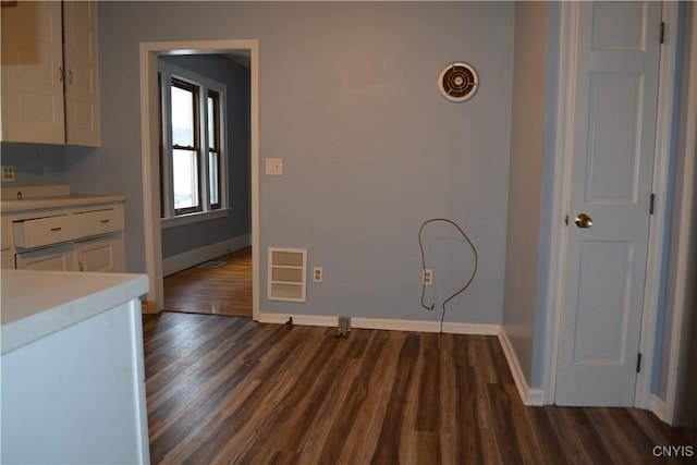 laundry area featuring dark hardwood / wood-style floors