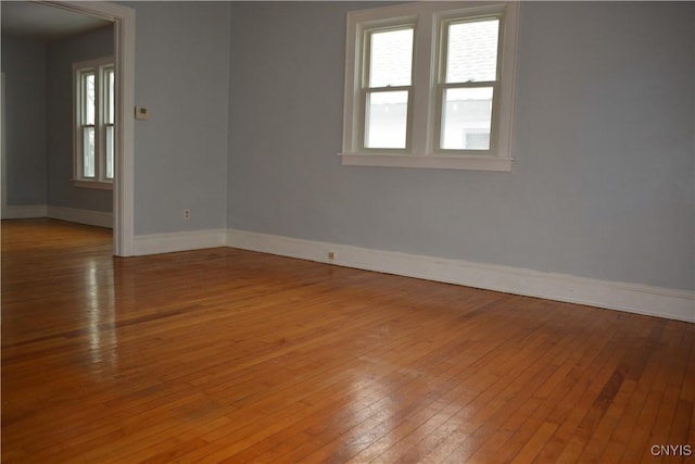 spare room featuring light hardwood / wood-style floors