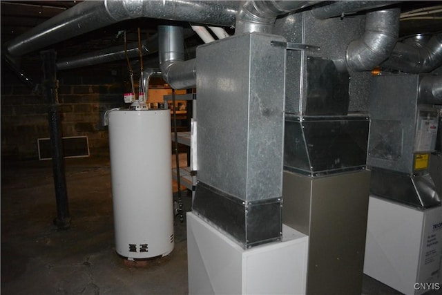 utility room featuring gas water heater