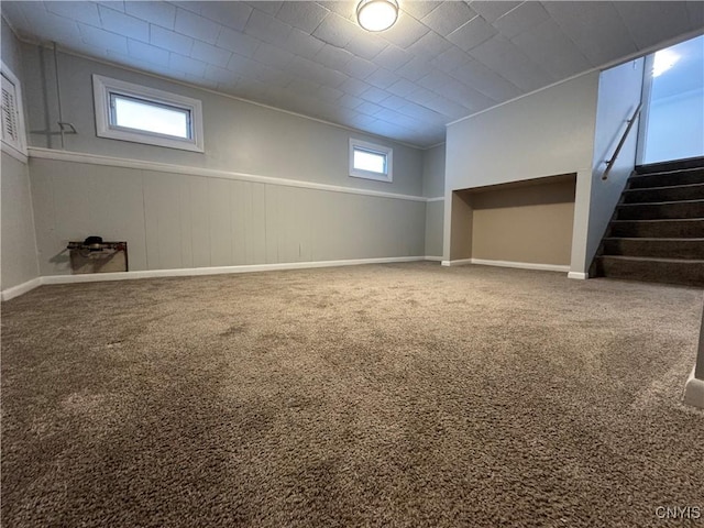 basement featuring carpet floors and a wealth of natural light