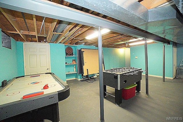 recreation room featuring concrete flooring