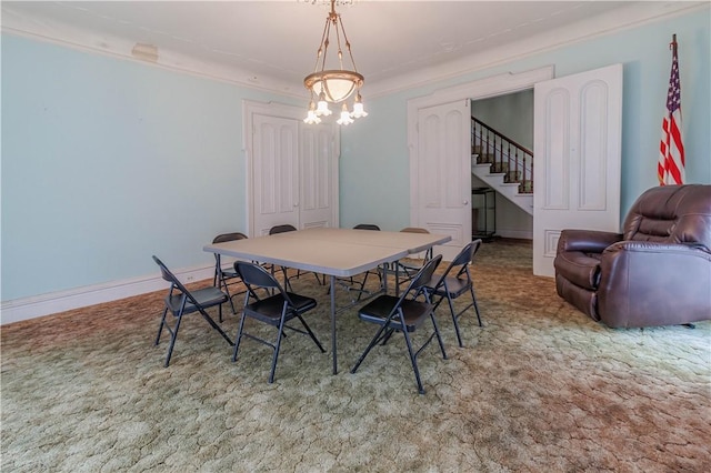 248 W Ave, Clarkson, NY 14420 - dining room with stairway, carpet flooring, a chandelier, and ornamental molding