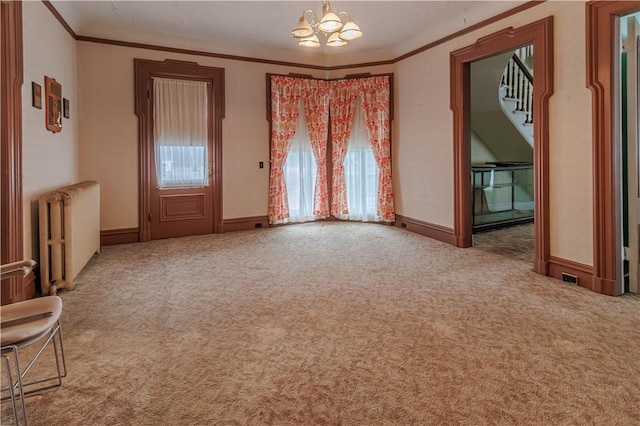 248 W Ave, Clarkson, NY 14420 - carpeted empty room with radiator heating unit, a chandelier, ornamental molding, and stairs