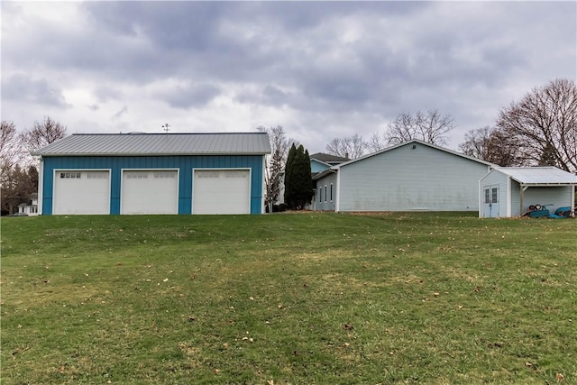248 W Ave, Clarkson, NY 14420 - view of grassy yard with a detached garage and an outbuilding