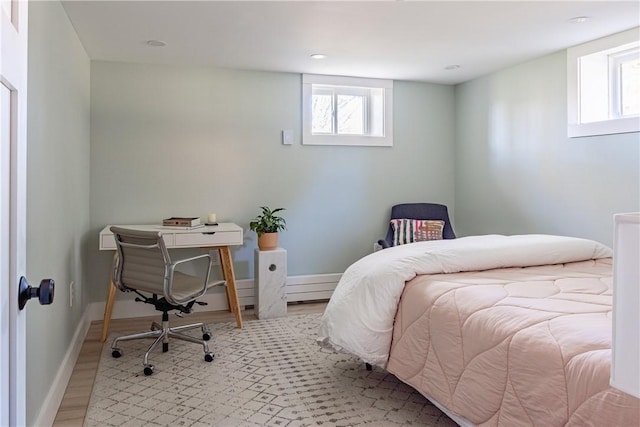 bedroom with light wood-type flooring