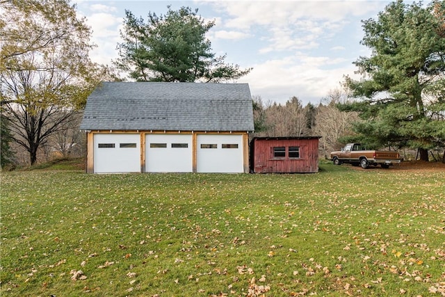 garage with a lawn