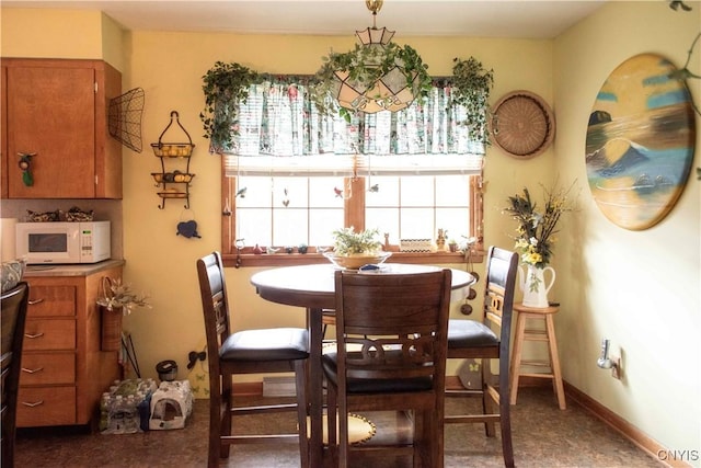 dining space featuring baseboards