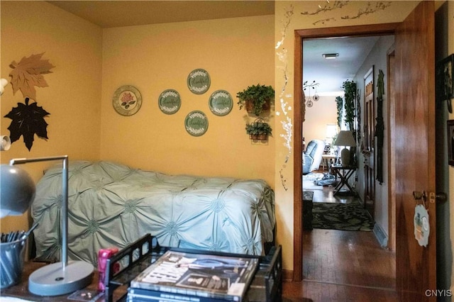 bedroom featuring wood finished floors