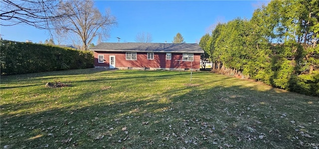 back of property with a yard