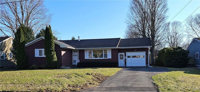 ranch-style home featuring a front yard, a garage, and aphalt driveway