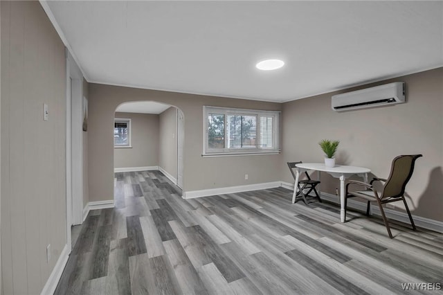 580 S Ogden St, Buffalo, NY 14206 - office featuring a wall mounted air conditioner, arched walkways, wood finished floors, and plenty of natural light