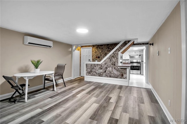 580 S Ogden St, Buffalo, NY 14206 - office area featuring a wall mounted AC and wood finished floors