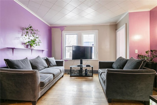 living room featuring hardwood / wood-style flooring and ornamental molding