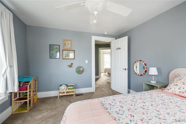 carpeted bedroom featuring ceiling fan