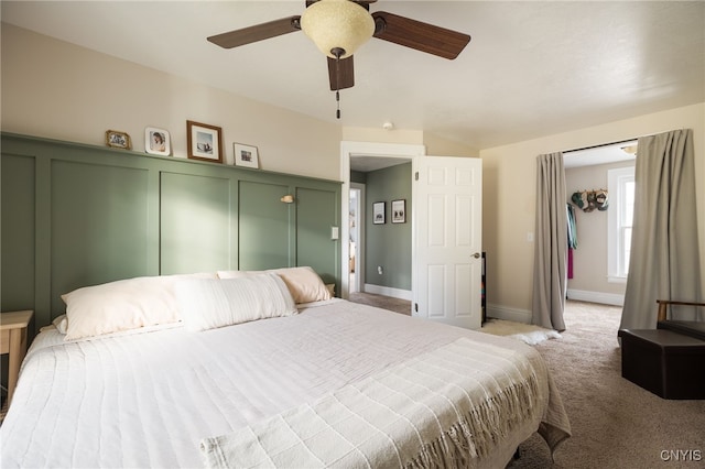 bedroom with ceiling fan and light carpet