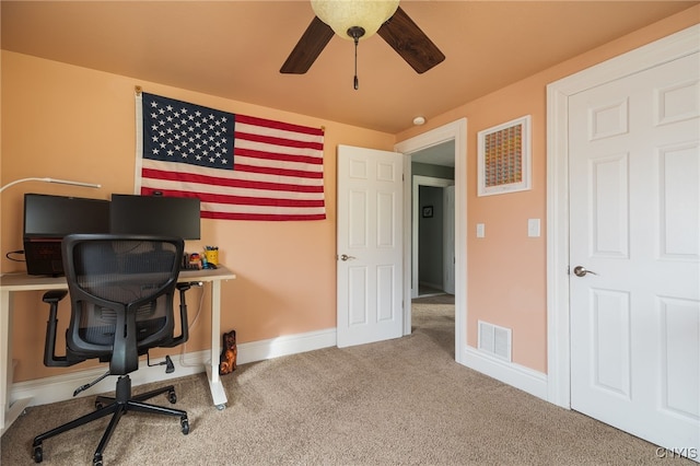 carpeted office with ceiling fan