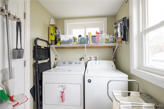 laundry area featuring washing machine and clothes dryer and plenty of natural light