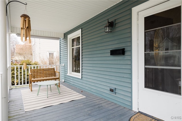 wooden terrace featuring a porch