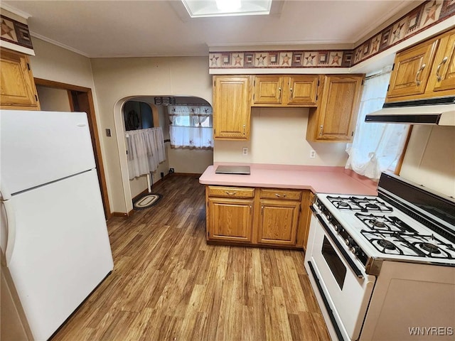 kitchen with light hardwood / wood-style flooring, white appliances, and ornamental molding