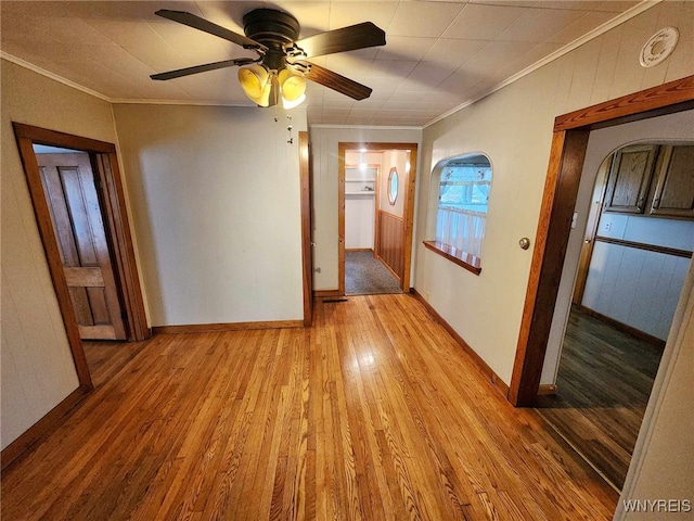 hall featuring crown molding and light wood-type flooring