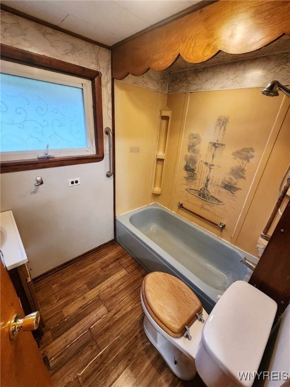 full bathroom featuring shower / washtub combination, toilet, vanity, and hardwood / wood-style flooring