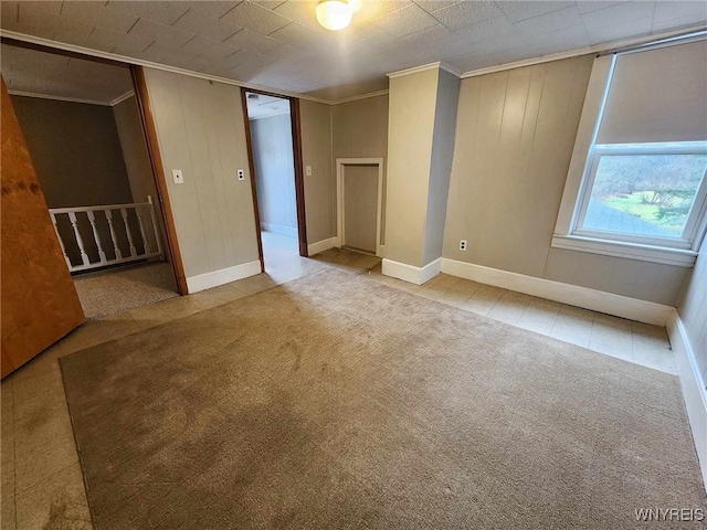 unfurnished room with ornamental molding