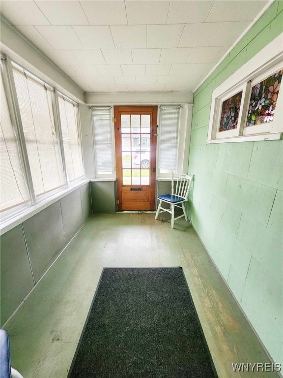 unfurnished sunroom featuring plenty of natural light