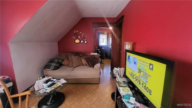 interior space featuring lofted ceiling and light parquet floors