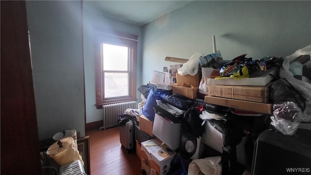 misc room with radiator heating unit and hardwood / wood-style flooring