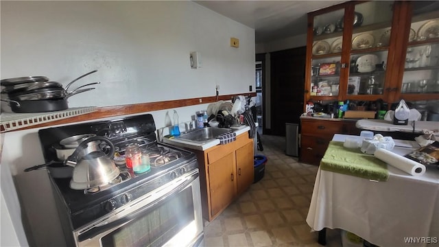 kitchen with electric stove and sink