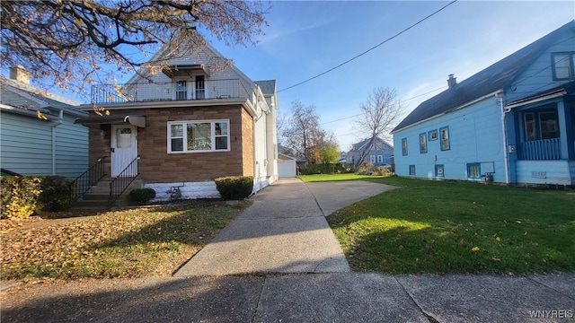 view of home's exterior with a yard, a garage, and an outdoor structure