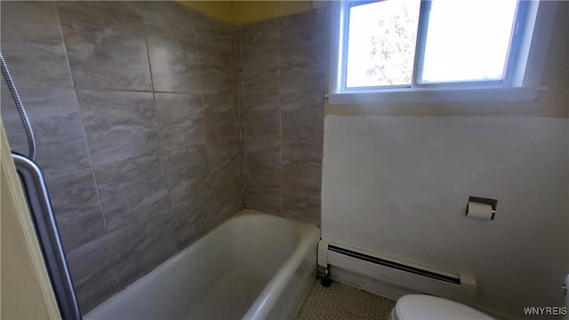 bathroom featuring tile patterned floors, a bathtub, toilet, and a baseboard radiator