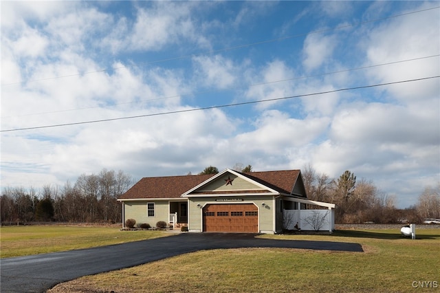 view of front facade featuring a front lawn and a garage