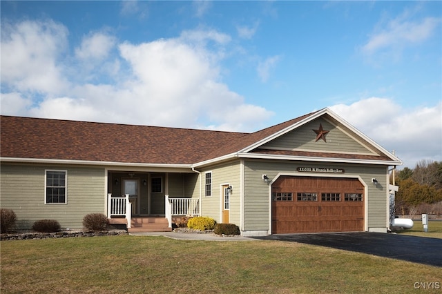 ranch-style house featuring a garage and a front yard