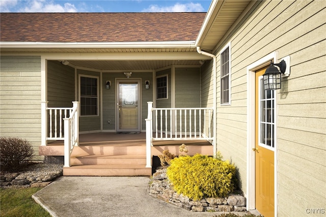 entrance to property featuring covered porch