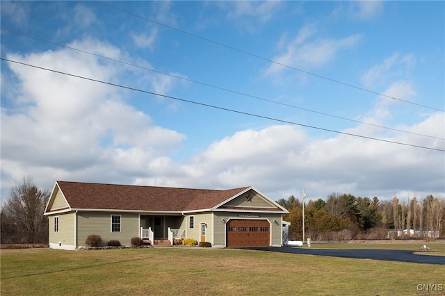 ranch-style home featuring a front yard and a garage