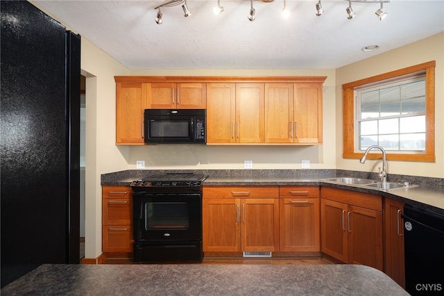 kitchen featuring sink and black appliances