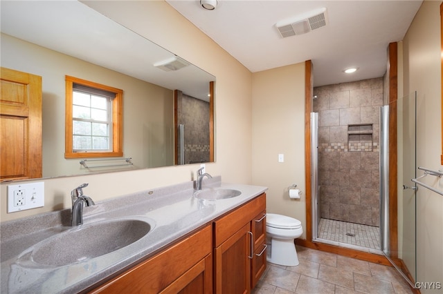 bathroom with walk in shower, tile patterned flooring, vanity, and toilet