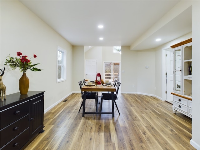 dining space featuring hardwood / wood-style flooring