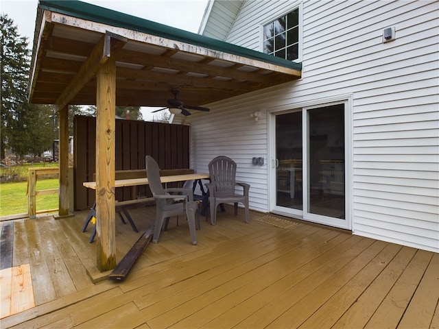 wooden terrace featuring ceiling fan