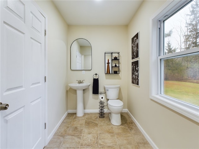 bathroom with sink and toilet