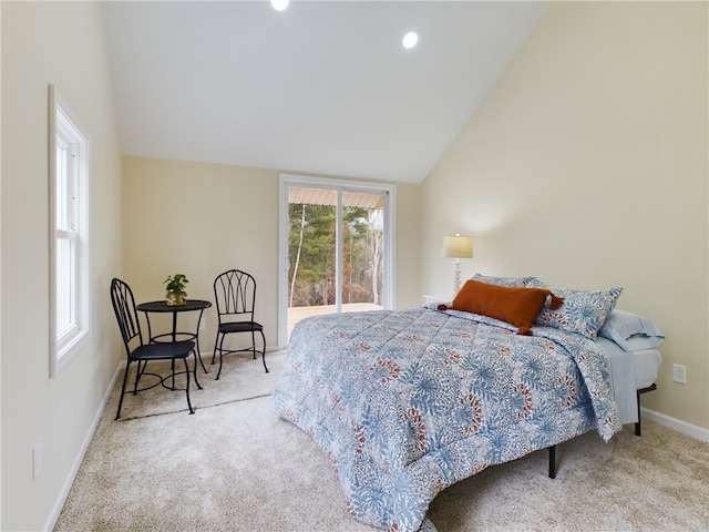 carpeted bedroom with vaulted ceiling